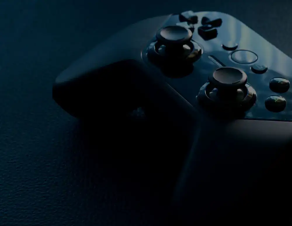 Close-up of game design sketches and a controller